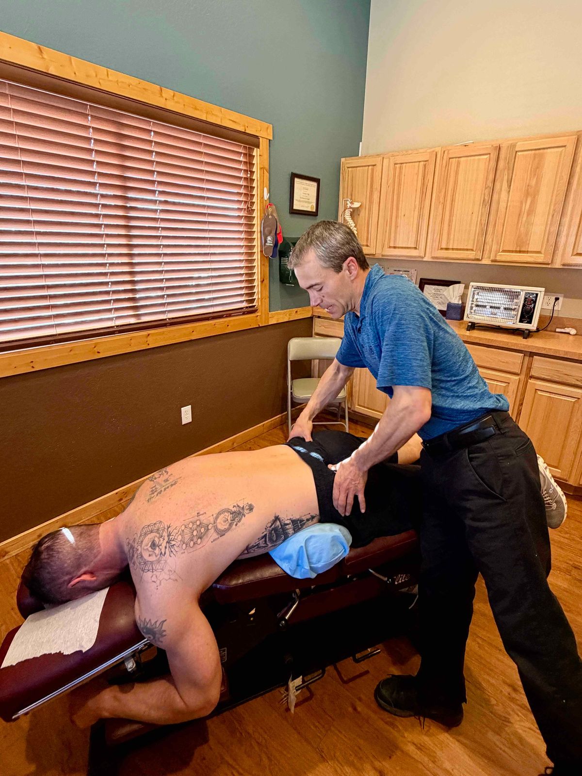 Dr. Roy performing a chiropractic adjustment